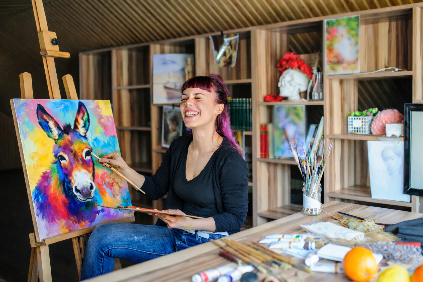 Artist painting colorful donkey portrait